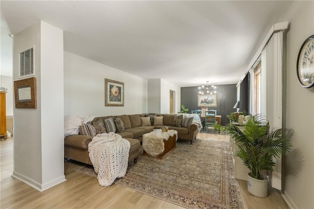 2931 N Washington St, Chillicothe, MO 64601 - living area with light wood-style flooring, visible vents, and baseboards