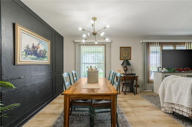 2931 N Washington St, Chillicothe, MO 64601 - dining room featuring a wealth of natural light, light wood finished floors, and an inviting chandelier