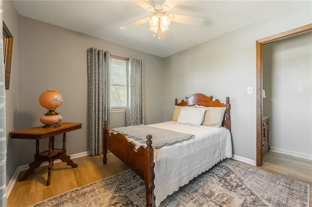 2931 N Washington St, Chillicothe, MO 64601 - bedroom with ceiling fan, baseboards, and wood finished floors