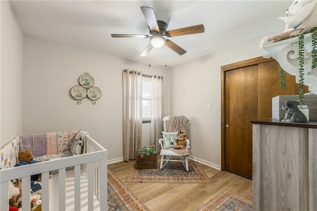 2931 N Washington St, Chillicothe, MO 64601 - bedroom with ceiling fan, baseboards, and light wood finished floors