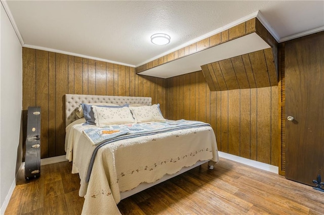 2931 N Washington St, Chillicothe, MO 64601 - bedroom with wood walls, ornamental molding, wood finished floors, and baseboards