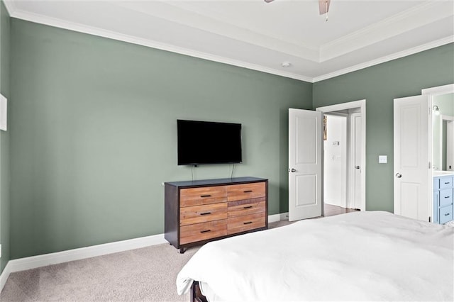 carpeted bedroom featuring baseboards, ornamental molding, and ceiling fan