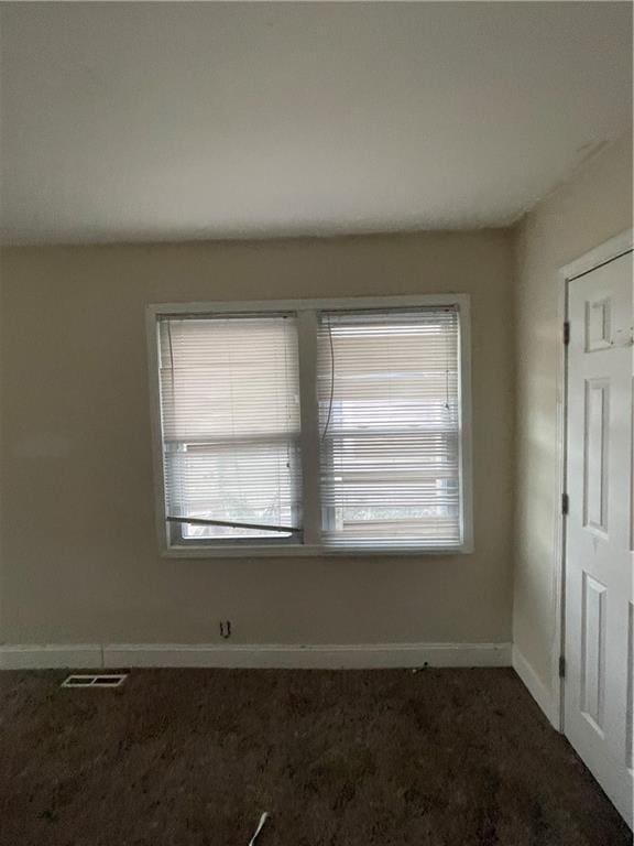 2000 S Overton Ave, Independence, MO 64052 - unfurnished room with visible vents, baseboards, and carpet floors