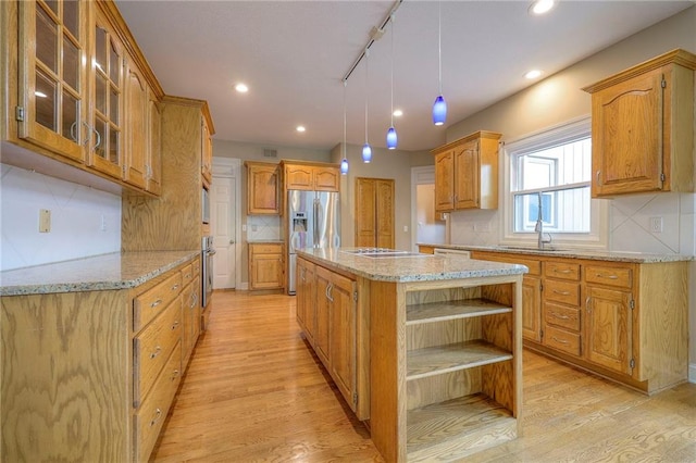 kitchen with light wood finished floors, open shelves, a kitchen island, and stainless steel refrigerator with ice dispenser