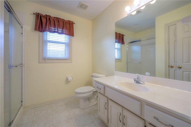 full bathroom featuring vanity, toilet, baseboards, visible vents, and a stall shower