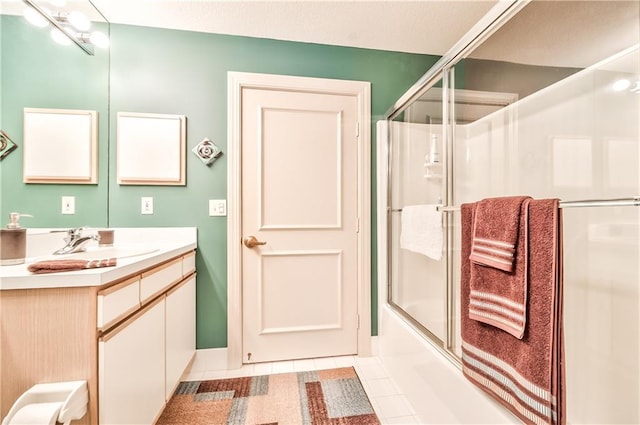 4949 Wornall Rd Unit 203, Kansas City, MO 64112 - full bathroom with vanity, tile patterned flooring, and bath / shower combo with glass door