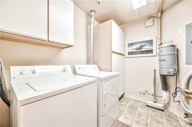 4949 Wornall Rd Unit 203, Kansas City, MO 64112 - laundry room with cabinet space, washer and dryer, baseboards, attic access, and electric panel