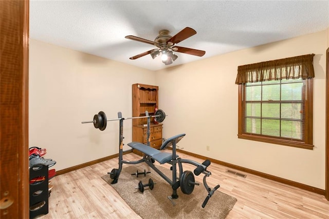 2501 Olde Creek Ct S, Leavenworth, KS 66048 - workout area with light wood-style flooring and a ceiling fan