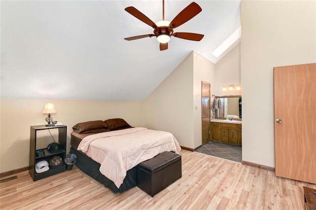 2501 Olde Creek Ct S, Leavenworth, KS 66048 - bedroom featuring light wood-style flooring, lofted ceiling, ensuite bathroom, a skylight, and a ceiling fan