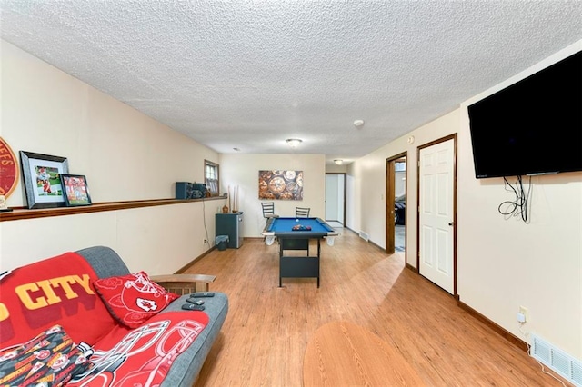 2501 Olde Creek Ct S, Leavenworth, KS 66048 - rec room with light wood finished floors, a textured ceiling, and billiards table