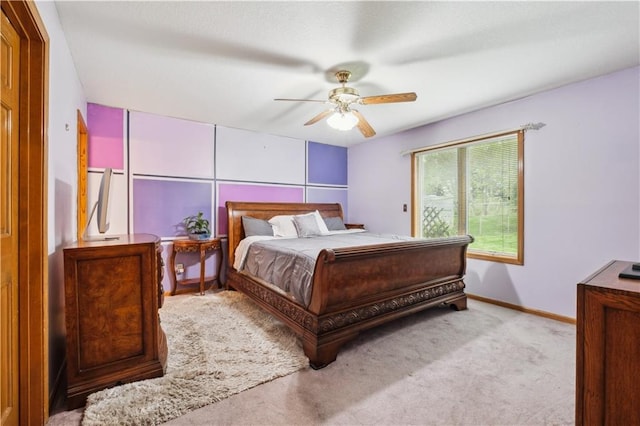 bedroom with carpet floors, a ceiling fan, and baseboards