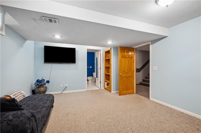 living area featuring stairs, light colored carpet, baseboards, and visible vents