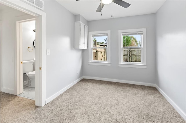 unfurnished bedroom with baseboards and carpet