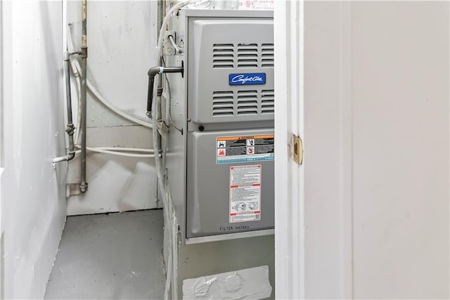 utility room with heating unit