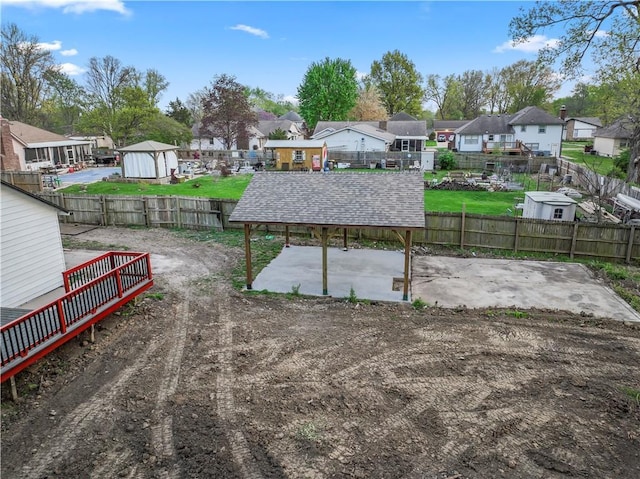 view of yard featuring fence and a residential view