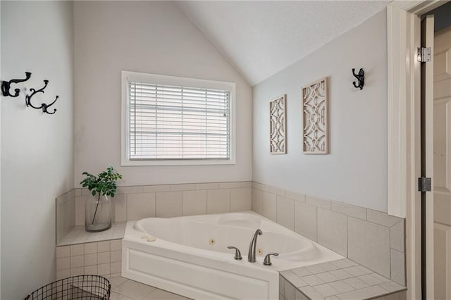 full bath with a tub with jets and lofted ceiling