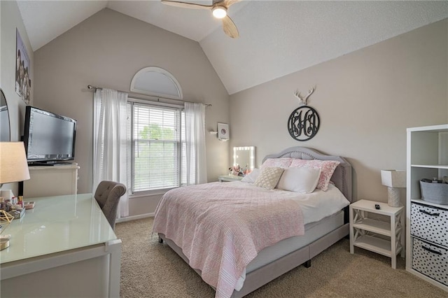 bedroom featuring ceiling fan, vaulted ceiling, and carpet