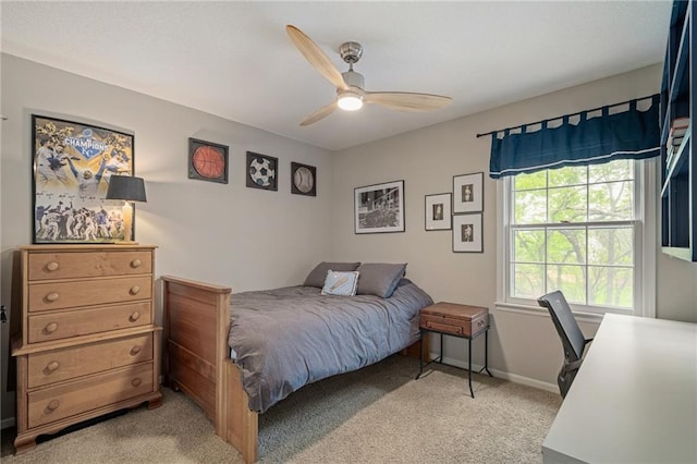 bedroom featuring baseboards, ceiling fan, and light colored carpet
