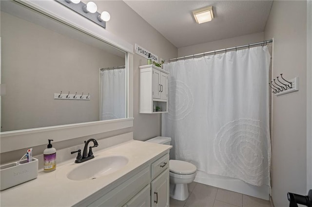 bathroom with tile patterned floors, vanity, toilet, and shower / tub combo