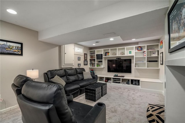 carpeted living area with recessed lighting