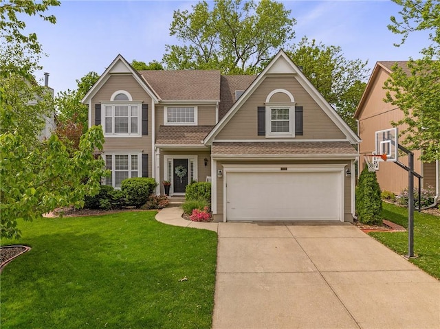 traditional home with a garage, a shingled roof, concrete driveway, and a front lawn
