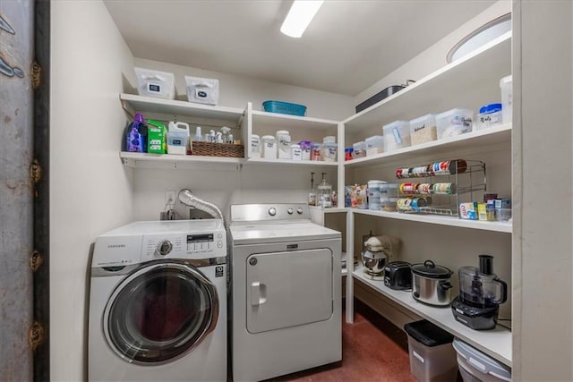 clothes washing area with separate washer and dryer