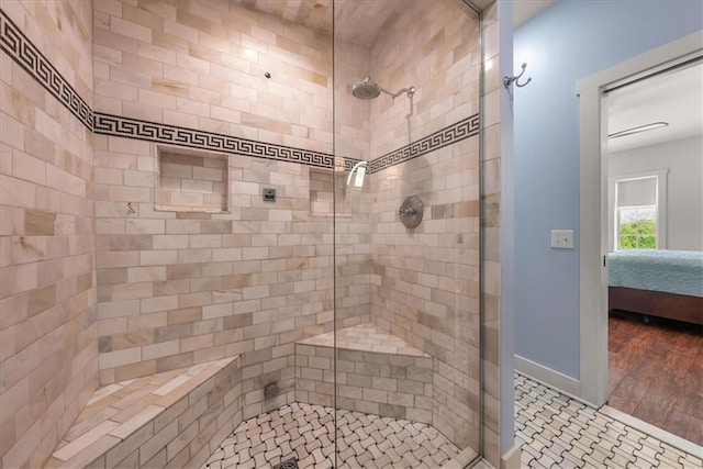 ensuite bathroom featuring a stall shower