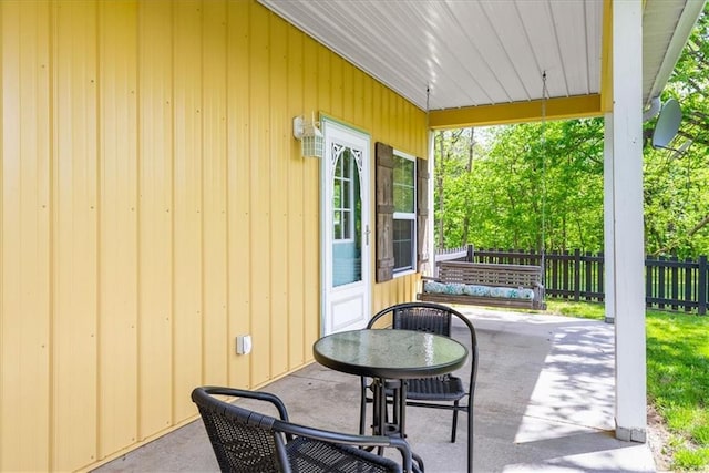 view of patio featuring fence