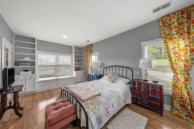bedroom with wood finished floors