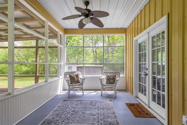 sunroom / solarium featuring ceiling fan and french doors