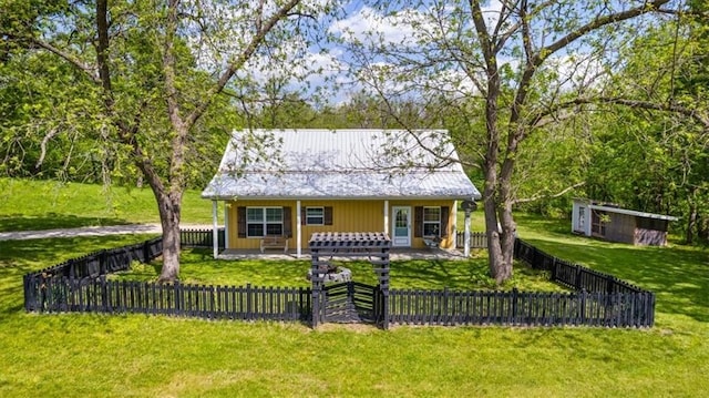 bungalow featuring a porch and metal roof
