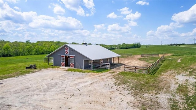 view of outbuilding with an exterior structure, an outdoor structure, and a view of countryside