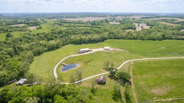 aerial overview of property's location with rural landscape and a nearby body of water
