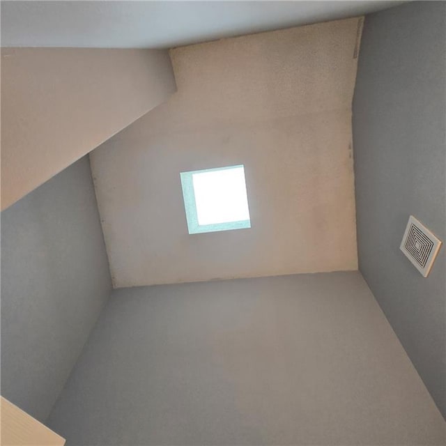 unfurnished room featuring visible vents