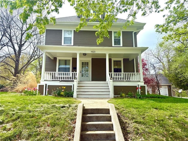 1420 N Mulberry St, Maryville, MO 64468 - american foursquare style home featuring a front yard, covered porch, and stairway