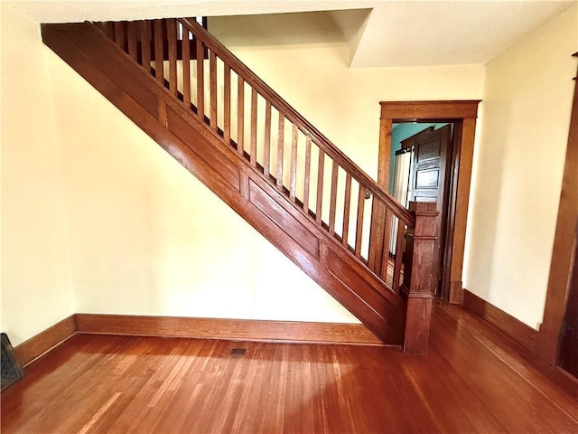1420 N Mulberry St, Maryville, MO 64468 - stairway with baseboards and wood finished floors