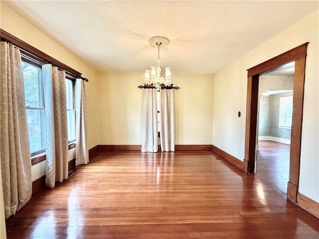 1420 N Mulberry St, Maryville, MO 64468 - unfurnished dining area featuring a chandelier, light wood-style flooring, and baseboards