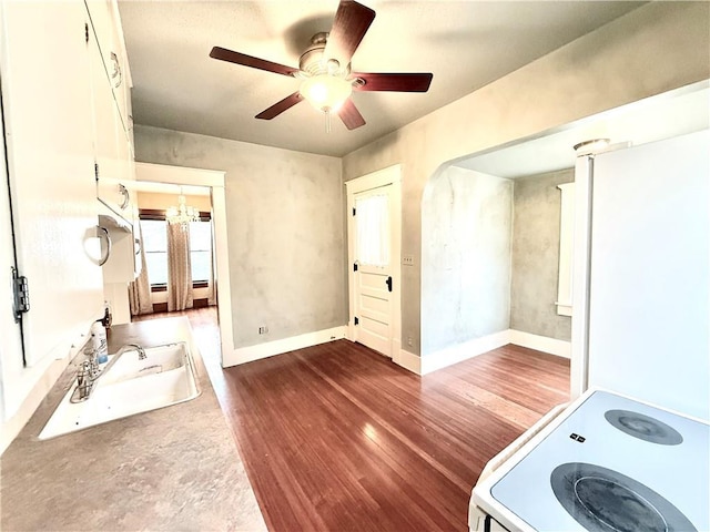 1420 N Mulberry St, Maryville, MO 64468 - interior space with wood finished floors, baseboards, ceiling fan, and a chandelier