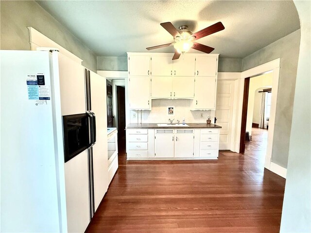 1420 N Mulberry St, Maryville, MO 64468 - kitchen with white fridge with ice dispenser, dark wood-type flooring, ceiling fan, a sink, and white cabinetry