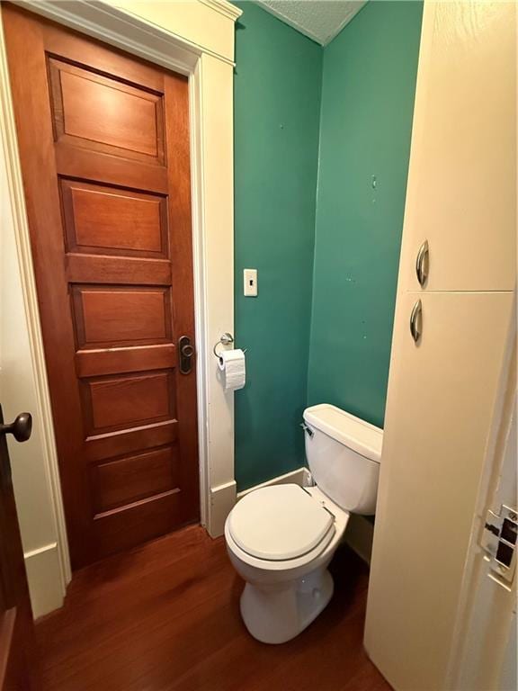 1420 N Mulberry St, Maryville, MO 64468 - bathroom with wood finished floors and toilet