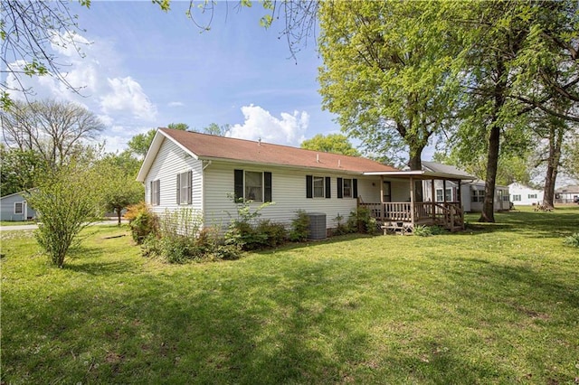 802 Cherry St, Lamar, MO 64759 - back of house featuring a lawn and central air condition unit