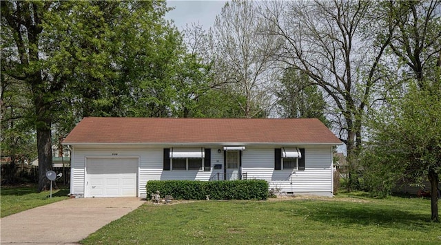 802 Cherry St, Lamar, MO 64759 - ranch-style home with an attached garage, driveway, and a front yard