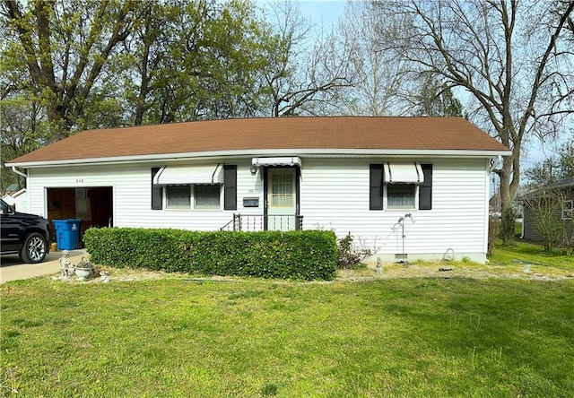 802 Cherry St, Lamar, MO 64759 - ranch-style home with an attached garage, concrete driveway, and a front lawn