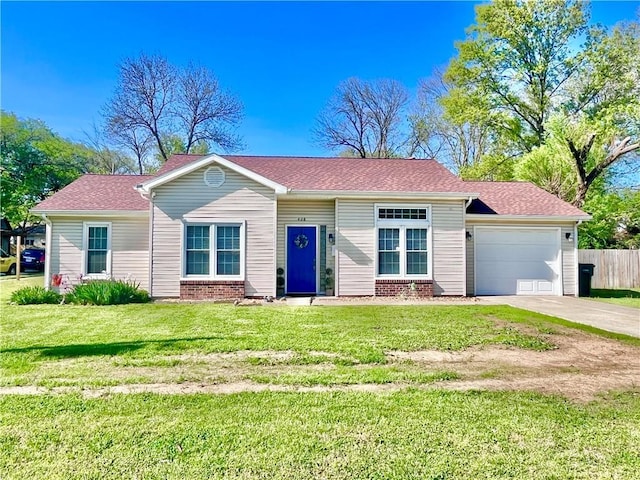 428 W Sycamore St, Nevada, MO 64772 - single story home featuring an attached garage, concrete driveway, and brick siding