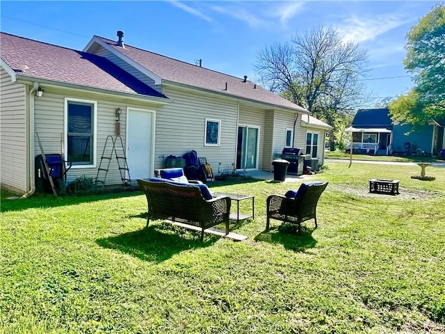 428 W Sycamore St, Nevada, MO 64772 - back of property featuring a yard and roof with shingles