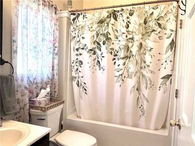 428 W Sycamore St, Nevada, MO 64772 - full bath featuring vanity, shower / bathtub combination with curtain, and toilet