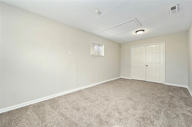 4818 E 45th St, Kansas City, MO 64130 - unfurnished bedroom featuring attic access, baseboards, visible vents, and carpet flooring