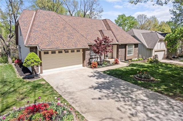 view of front of house with a front yard, a garage, driveway, board and batten siding, and roof with shingles