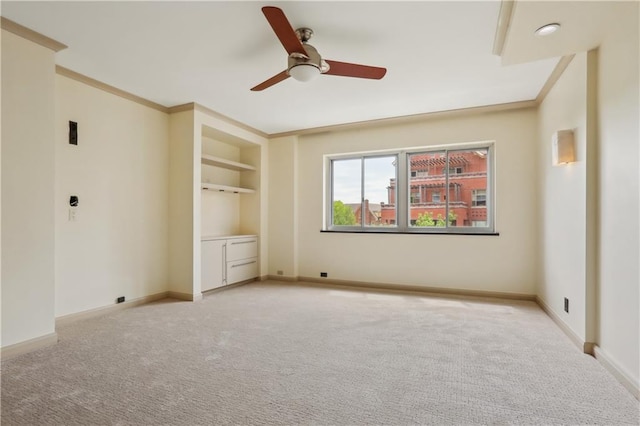 310 W 49th St Unit 705, Kansas City, MO 64112 - unfurnished bedroom with crown molding, baseboards, and light carpet