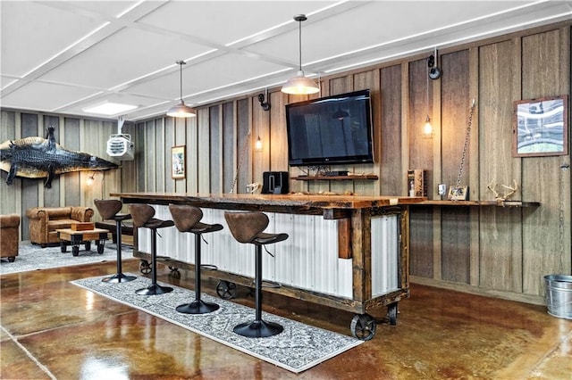 11155 Hubbard Rd, Kansas City, KS 66109 - bar area featuring concrete flooring and hanging light fixtures
